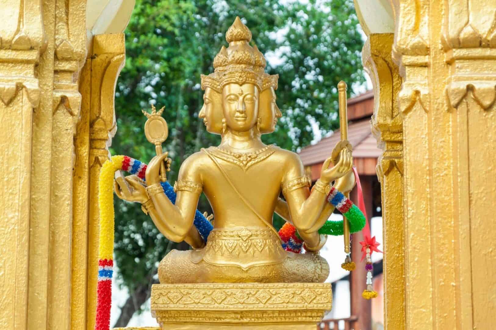 golden Buddhist god with gold columns surrounding it